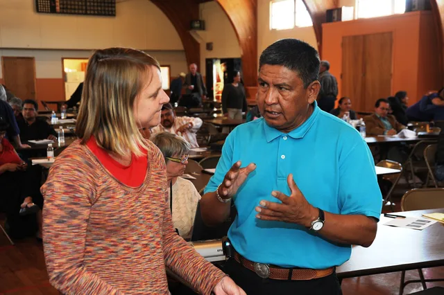 Window Rock, AZ, April 20, 2010 -- FEMA Public Assistance Coordinator Janice Fulton listens to Henry Hudson of the Fort Defiance Local Governance Service Center at the Navajo Nation applicant?s briefing and kick-off meeting. Because of severe winter storms, more than 100 Navajo chapter officials att. Running a customer data journey with people, not systems, making the decisions
