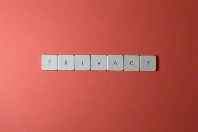 Close-up of letter tiles spelling PRIVACY on a red background, symbolizing data protection. Which UK regimes touch a customer data platform journey, and which role in the buyer's team owns each one